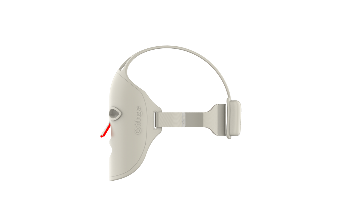 Fringe red light therapy face mask showing side profile with adjustable straps.