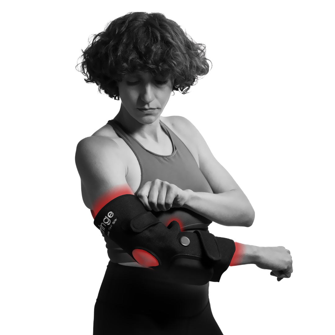 Fringe red light therapy wrap on an elbow with red light therapy zones.